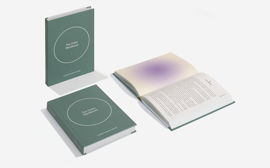 The Calm Workbook byt The School Of Life - three calm workbooks, one laying open, one standing ad one laying closed